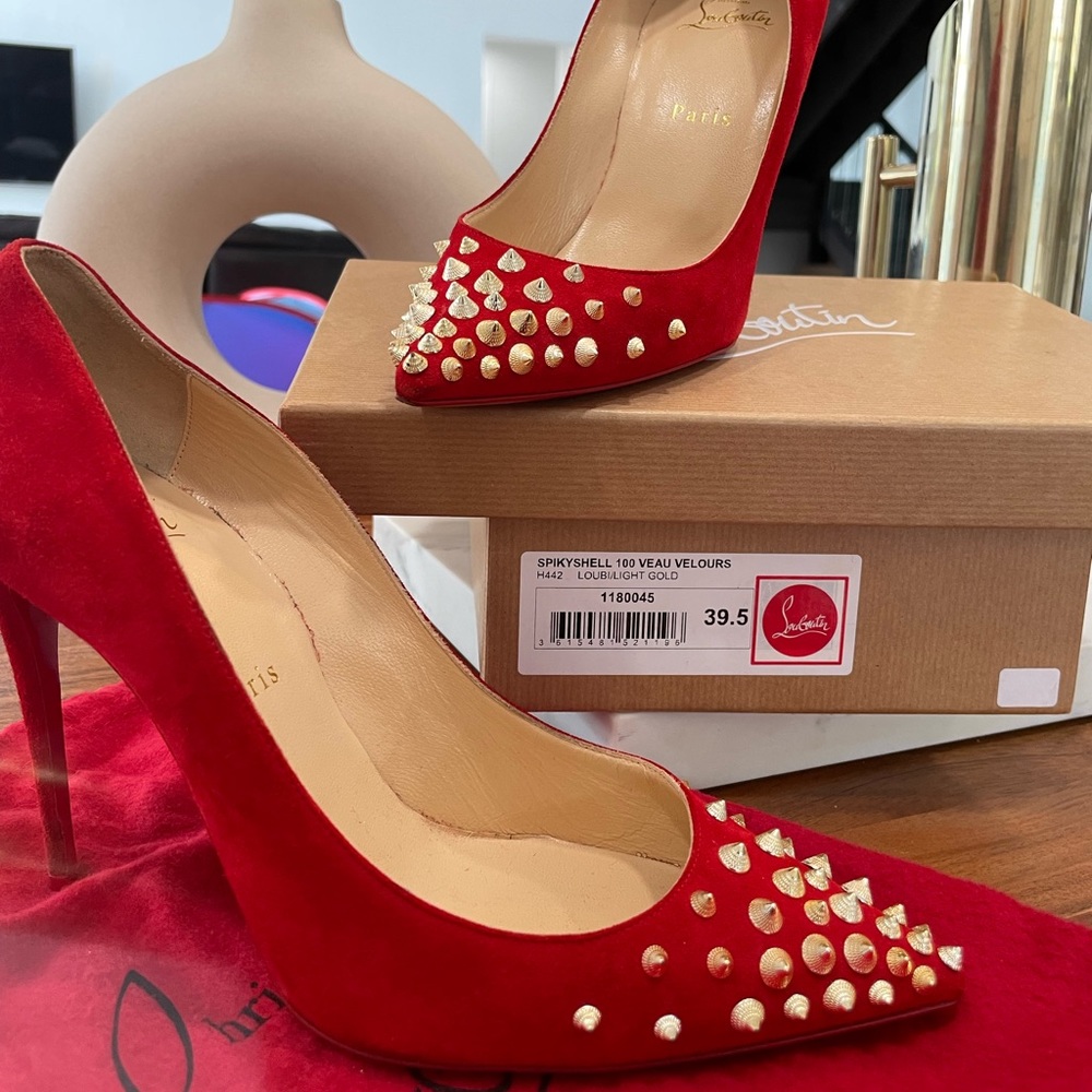 Christian Louboutin Spiky Shell heels in Louboutin Red